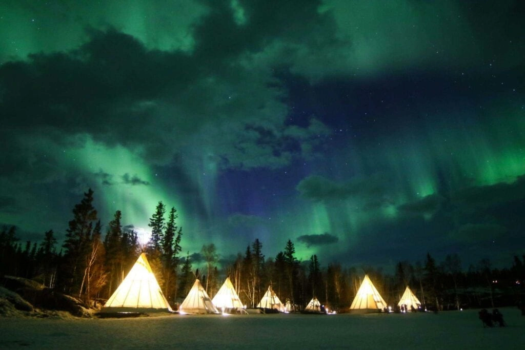 Aurora village yellowknife northwest territories canada aurora borealis northern lights teepees winter hero cloud
