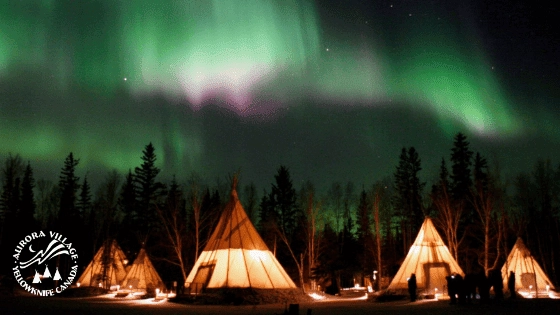 Aurora village yellowknife northwest territories canada aurora borealis northern lights winter teepees watermark