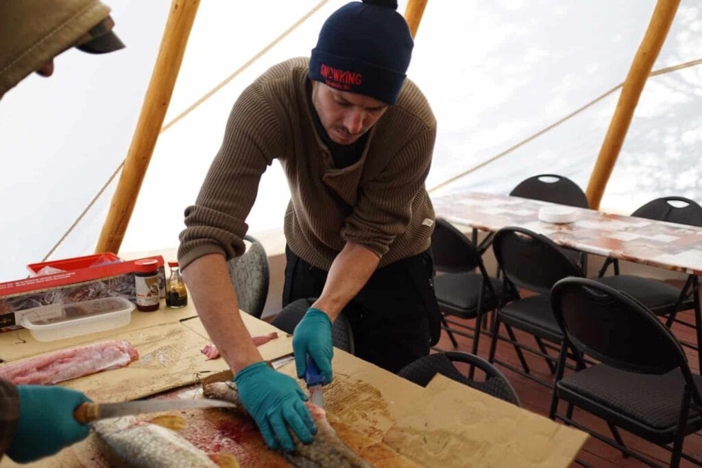 Aurora village yellowknife northwest territories canada aurora borealis northern lights teepees ice fishing joel gutting