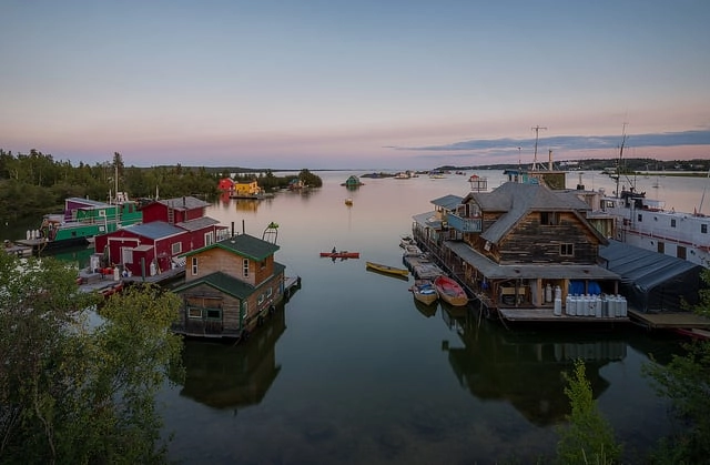 Aurora village yellowknife northwest territories canada aurora borealis northern lights hero lake houseboats summer credit gawain jones 600