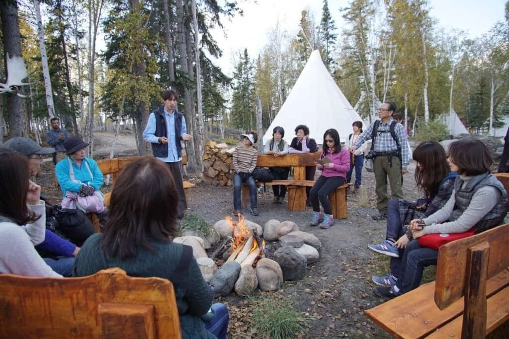 Aurora village yellowknife northwestterritories cultural hiking tour fire
