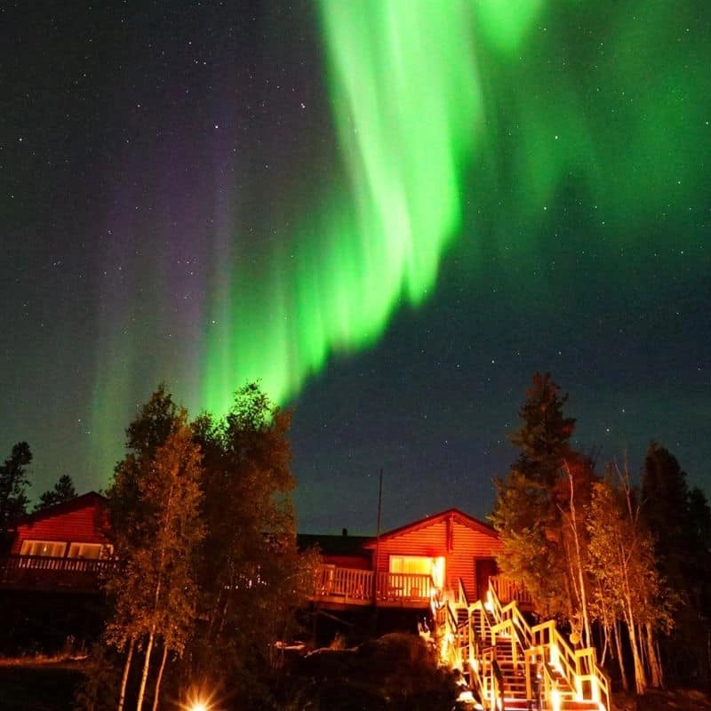 Instagram aurora village yellowknife northwest territories canada aurora borealis northern lights summer dining hall green purple hero