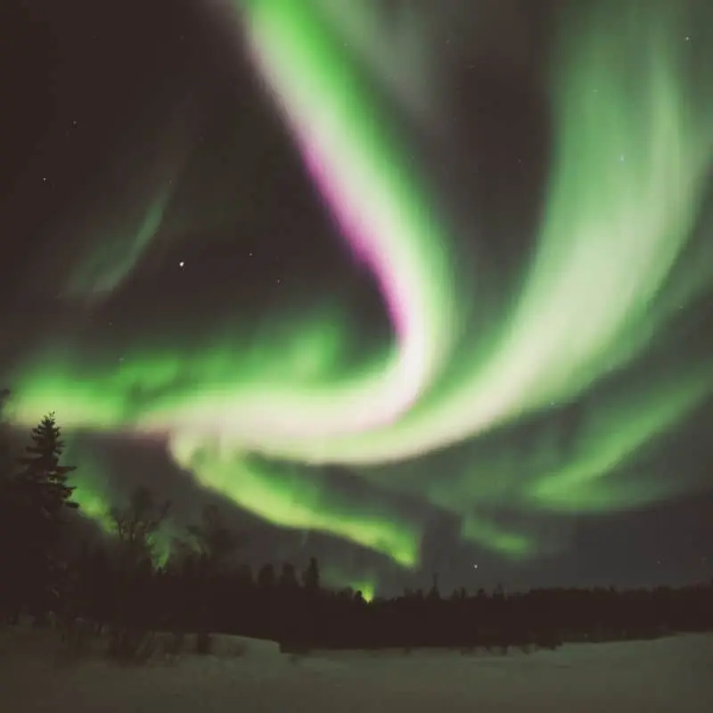 Instagram aurora above teepee village yellowknife forest where northwest territories pink