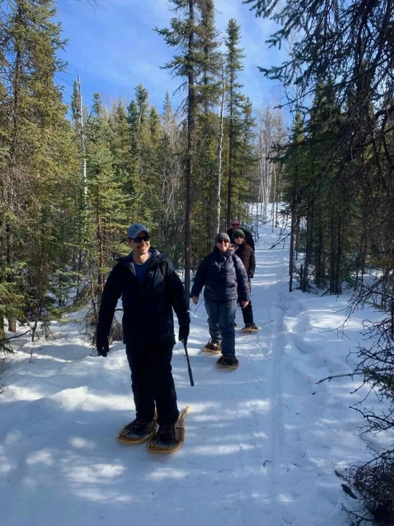 Portrait aurora village yellowknife northwest territories canada aurora borealis northern lights teepee frame sedastien itac snowshoe tour winter mike 1